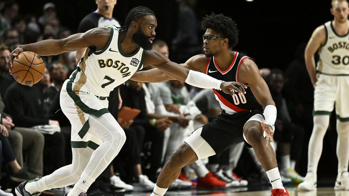 Boston Celtics guard Jaylen Brown (7) drives to the basket during the first half against Portland Trail Blazers guard Scoot Henderson (00) at Moda Center.