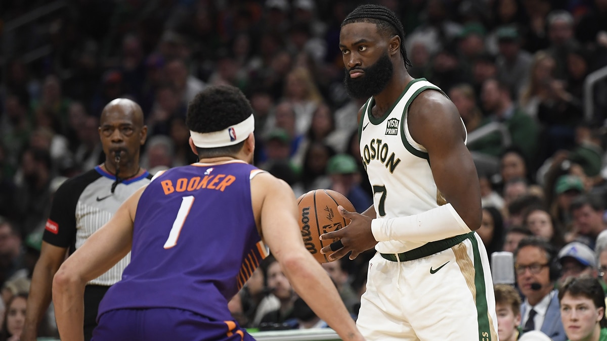 Boston Celtics guard Jaylen Brown (7) controls the ball while Phoenix Suns guard Devin Booker (1) defends during the second half at TD