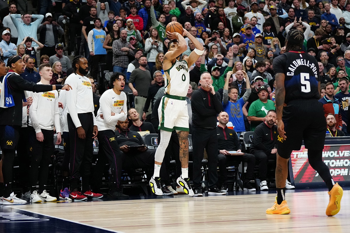 Boston Celtics forward Jayson Tatum (0) prepares to shoot a three-point attempt in the fourth quarter against the Denver Nuggets at Ball Arena.