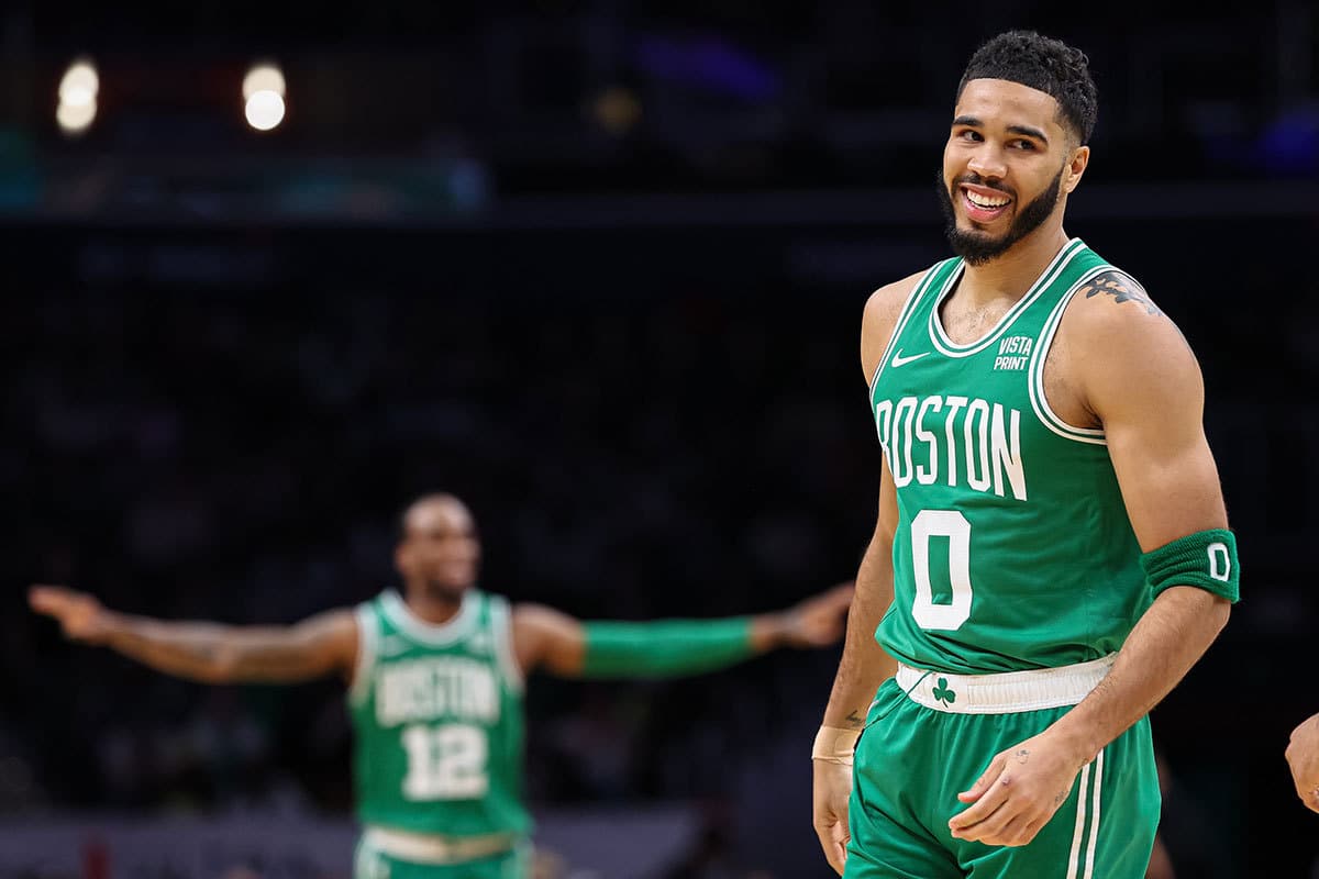 Boston Celtics forward Jayson Tatum (0) reacts after a play against the Washington Wizards during the first half of the game at Capital One Arena. 