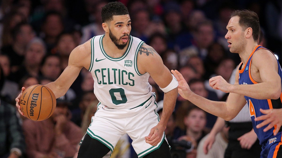 Boston Celtics forward Jayson Tatum (0) controls the ball against New York Knicks forward Bojan Bogdanovic (44) during the fourth quarter at Madison Square Garden.