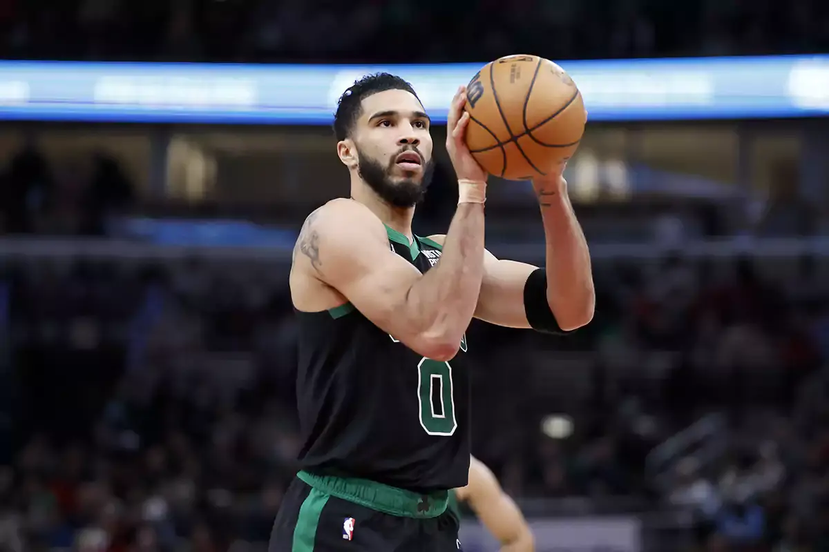 Boston Celtics forward Jayson Tatum (0) shoots a free throw against the Chicago Bulls during the second half at United Center.