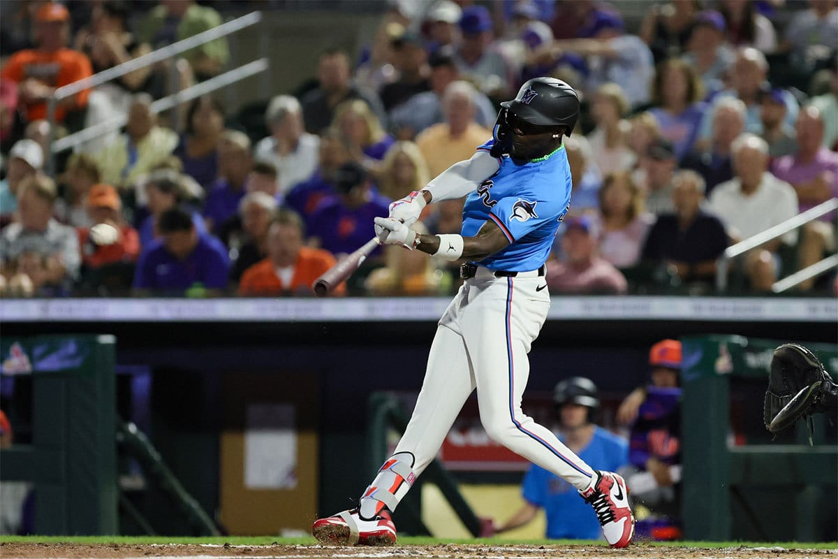 Miami Marlins center fielder Jazz Chisholm Jr.(2) hits a single against the New York Mets during the fourth inning at Roger Dean Chevrolet Stadium. 