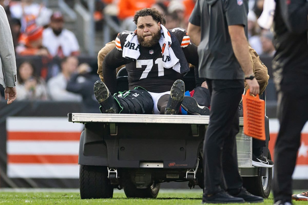 Cleveland Browns offensive tackle Jedrick Wills Jr. (71) cries as he is carted off the field following an injury during the third quarter against the Arizona Cardinals at Cleveland Browns Stadium.