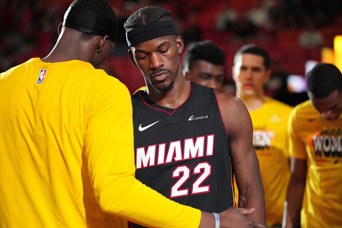 Miami Heat forward Jimmy Butler (22) is greeted by center Bam Adebayo (13) during pregame ceremonies before the game against the Cleveland Cavaliers at Kaseya Center. 