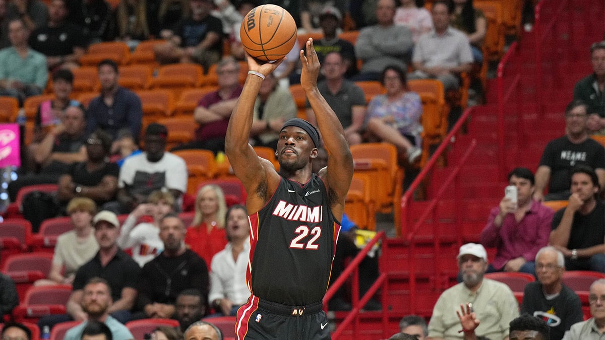 Miami Heat guard Jimmy Butler (22) attempts a shot against the Cleveland Cavaliers during the first half at Kaseya Center. 