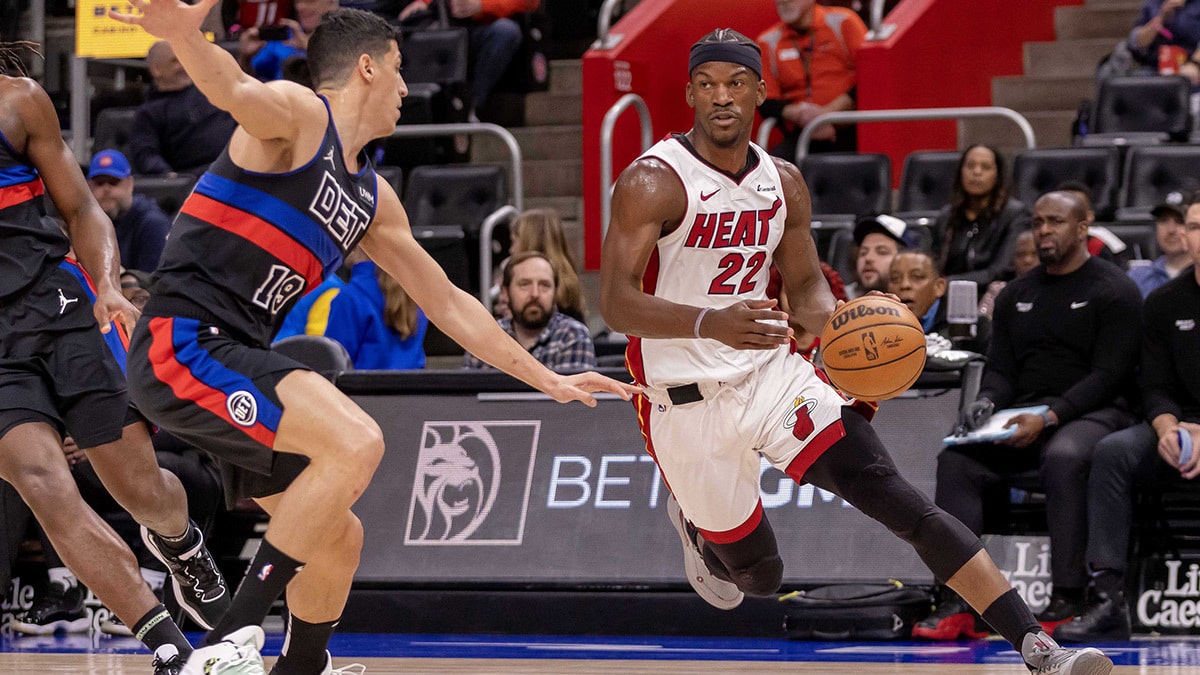 Miami Heat forward Jimmy Butler (22) drives to the basket as Detroit Pistons forward Simone Fontecchio (19) defends during the first quarter at Little Caesars Arena. 
