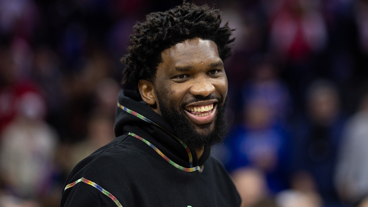 Injured Philadelphia 76ers center Joel Embiid smiles after a victory against the Charlotte Hornets at Wells Fargo Center. 