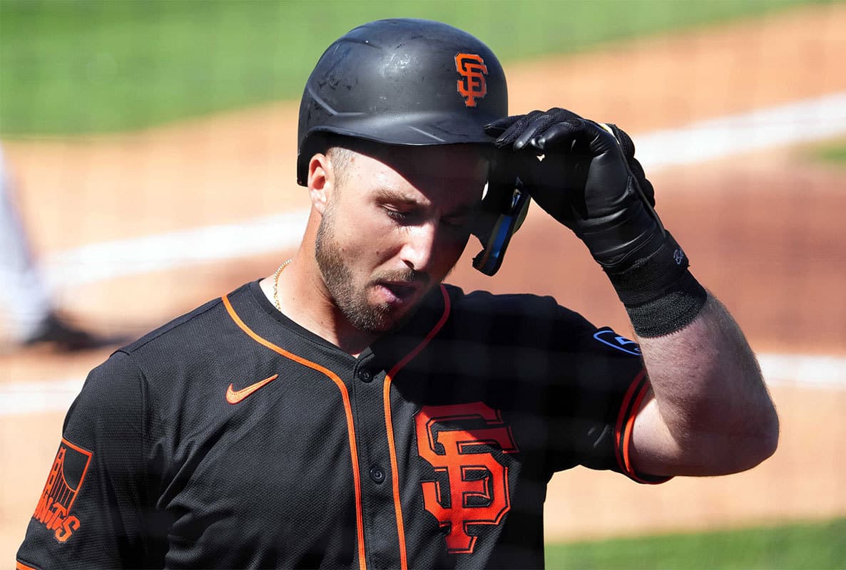 San Francisco Giants designated hitter Joey Bart (21) reacts after striking out against the Kansas City Royals during the second inning at Surprise Stadium.