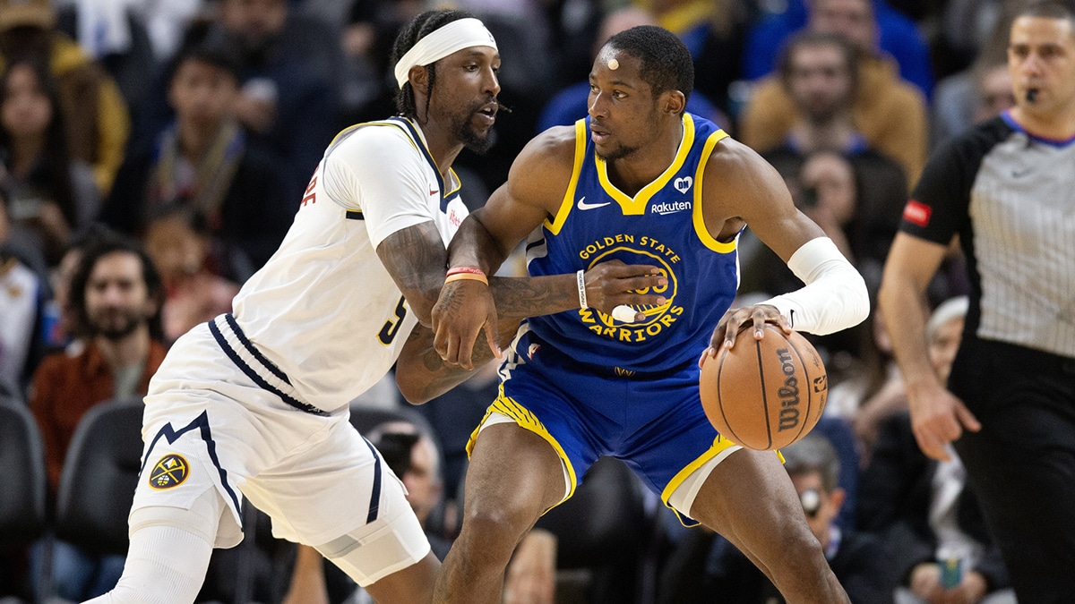 Golden State Warriors forward Jonathan Kuminga (00) tries to back down Denver Nuggets guard Kentavious Caldwell-Pope (5) during the third quarter at Chase Center.
