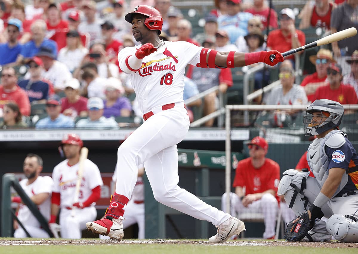 St. Louis Cardinals right fielder Jordan Walker (18) follows through on his home run against the Houston Astros in the second inning at Roger Dean Chevrolet Stadium. 