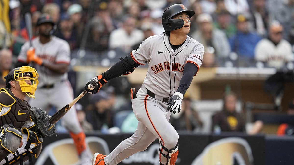 San Francisco Giants center fielder Jung Hoo Lee (51) hits an RBI sacrifice fly against the San Diego Padres during the fifth inning at Petco Park.