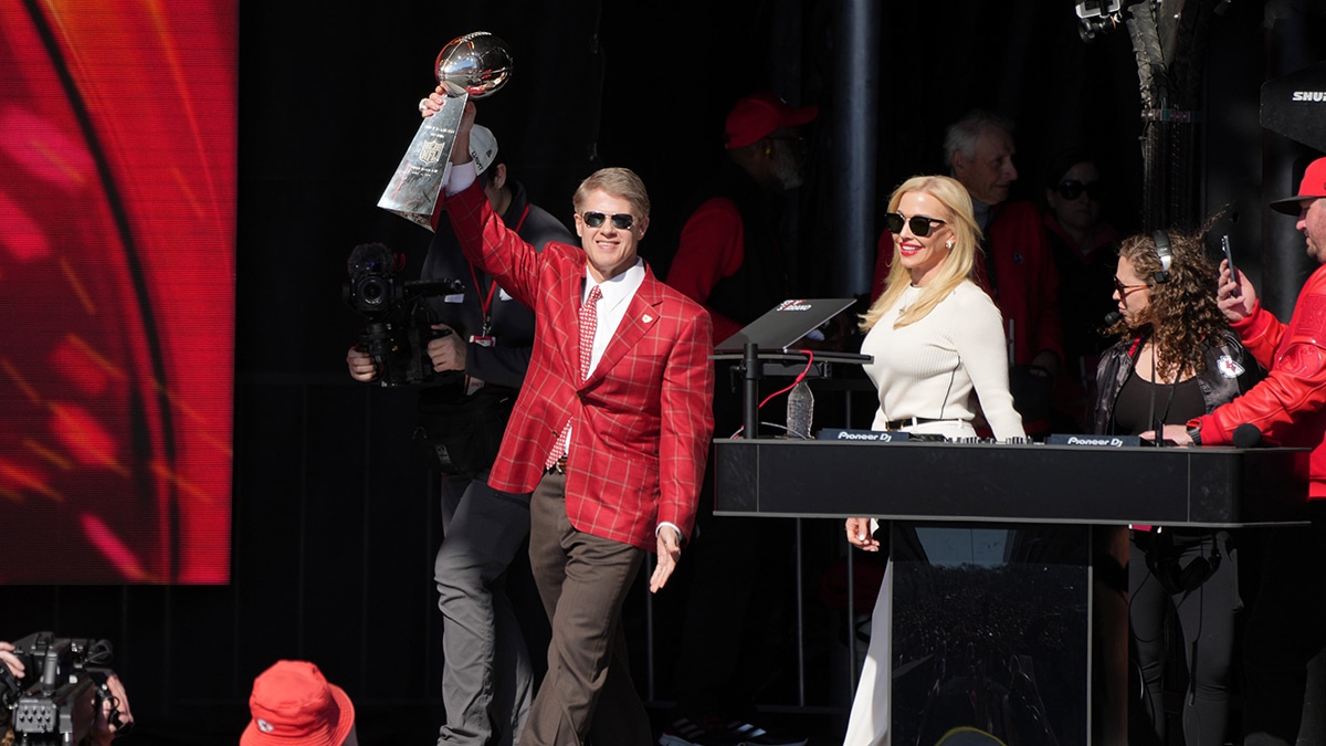 Kansas City Chiefs owner Clark Hunt celebrates with the Vince Lombardi Trophy on stage during the celebration of the Kansas City Chiefs winning Super Bowl LVIII