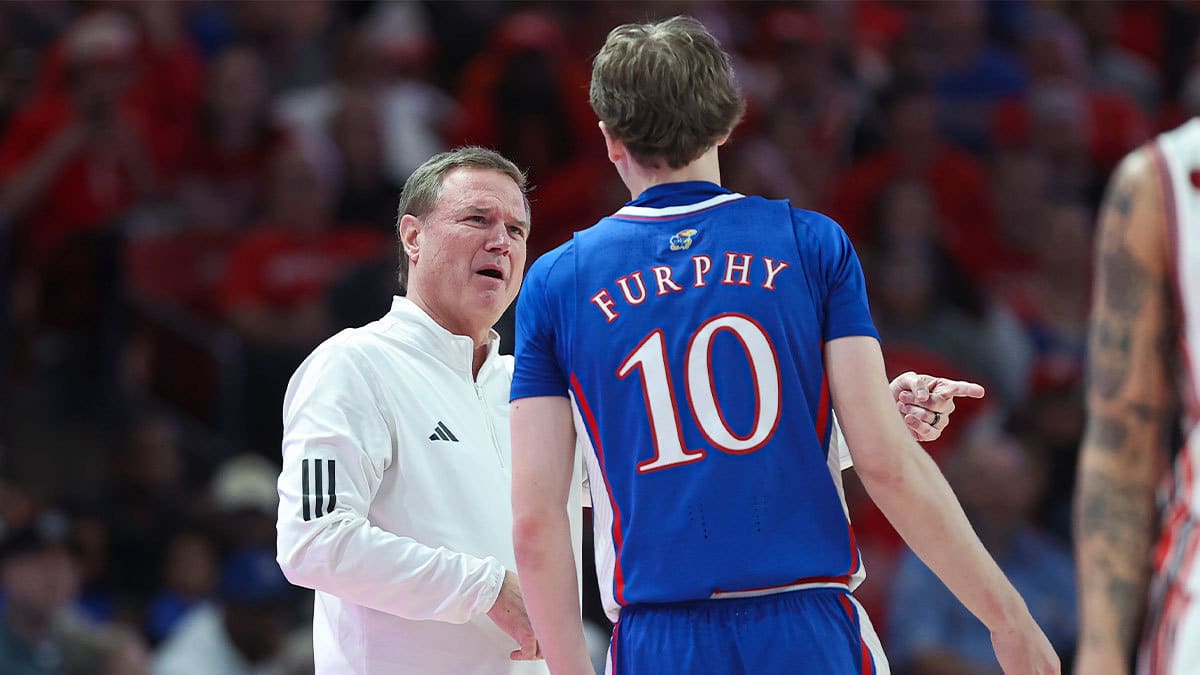Kansas Jayhawks head coach Bill Self talks with guard Johnny Furphy (10) during the second half against the Houston Cougars at Fertitta Center