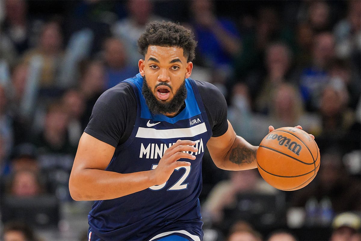 Minnesota Timberwolves center Karl-Anthony Towns (32) dribbles against the Portland Trail Blazers in the third quarter at Target Center.