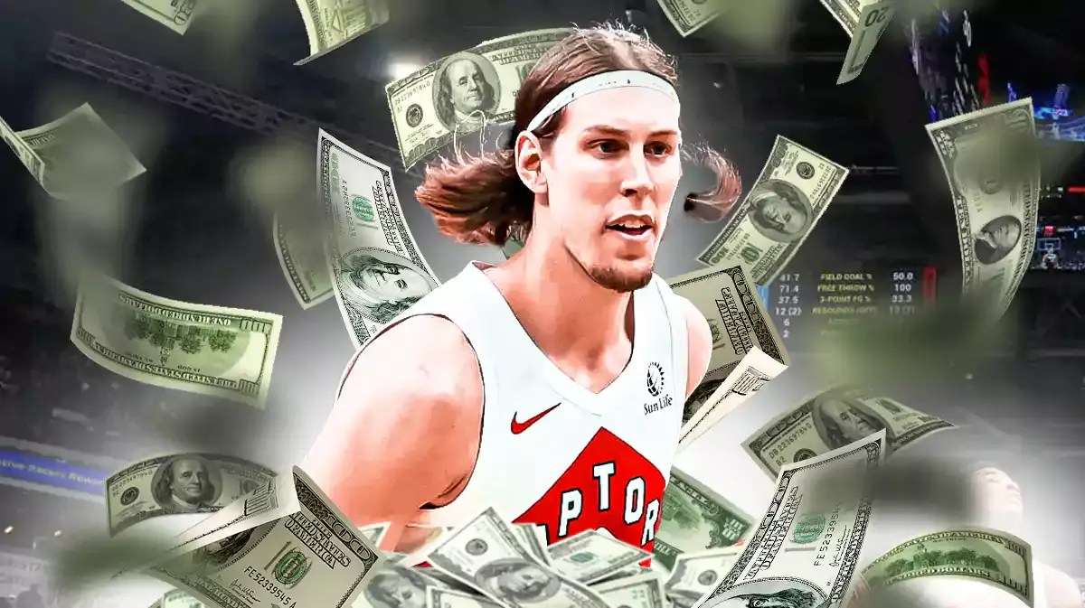 Raptors' Kelly Olynyk with money falling down around him.