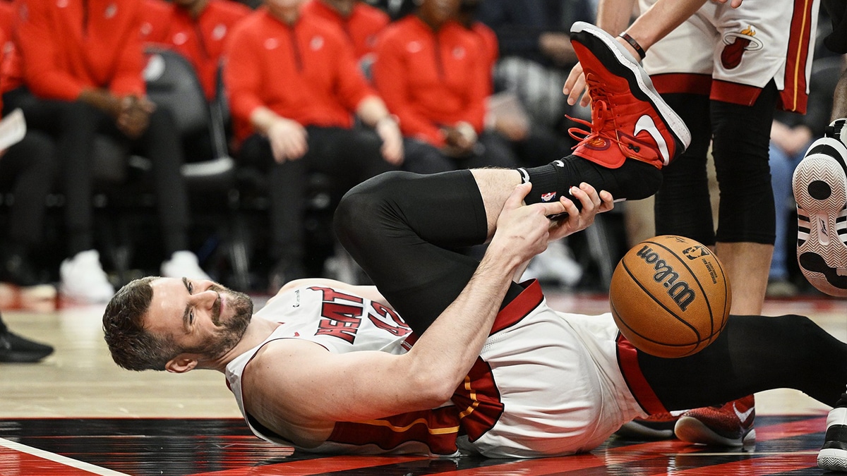 Miami Heat forward Kevin Love (42) insures his ankle during the first half against the Portland Trail Blazers at Moda Center.
