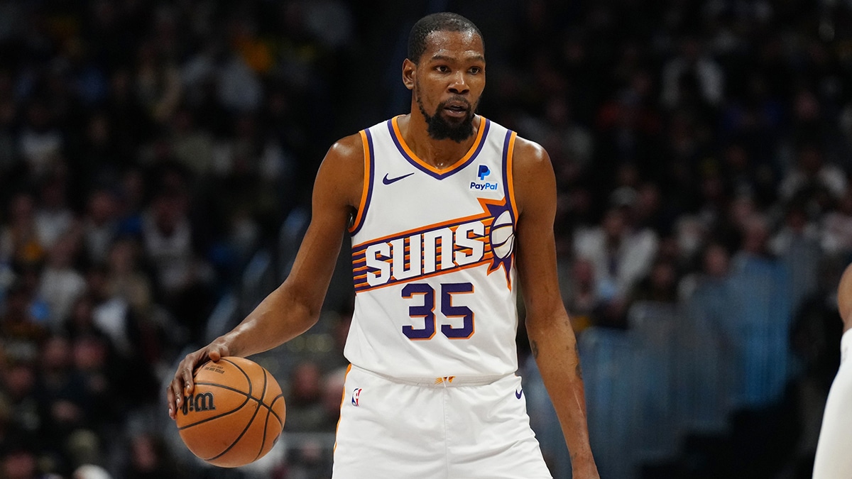Phoenix Suns forward Kevin Durant (35) controls the ball during the fourth quarter against the Denver Nuggets at Ball Arena.