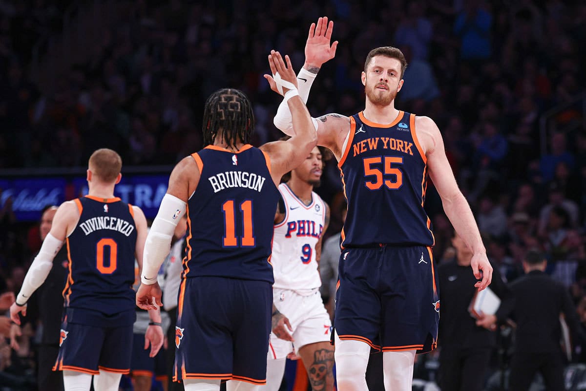 New York Knicks center Isaiah Hartenstein (55) slaps hands with guard Jalen Brunson (11) during the second quarter against the Philadelphia 76ers at Madison Square Garden.