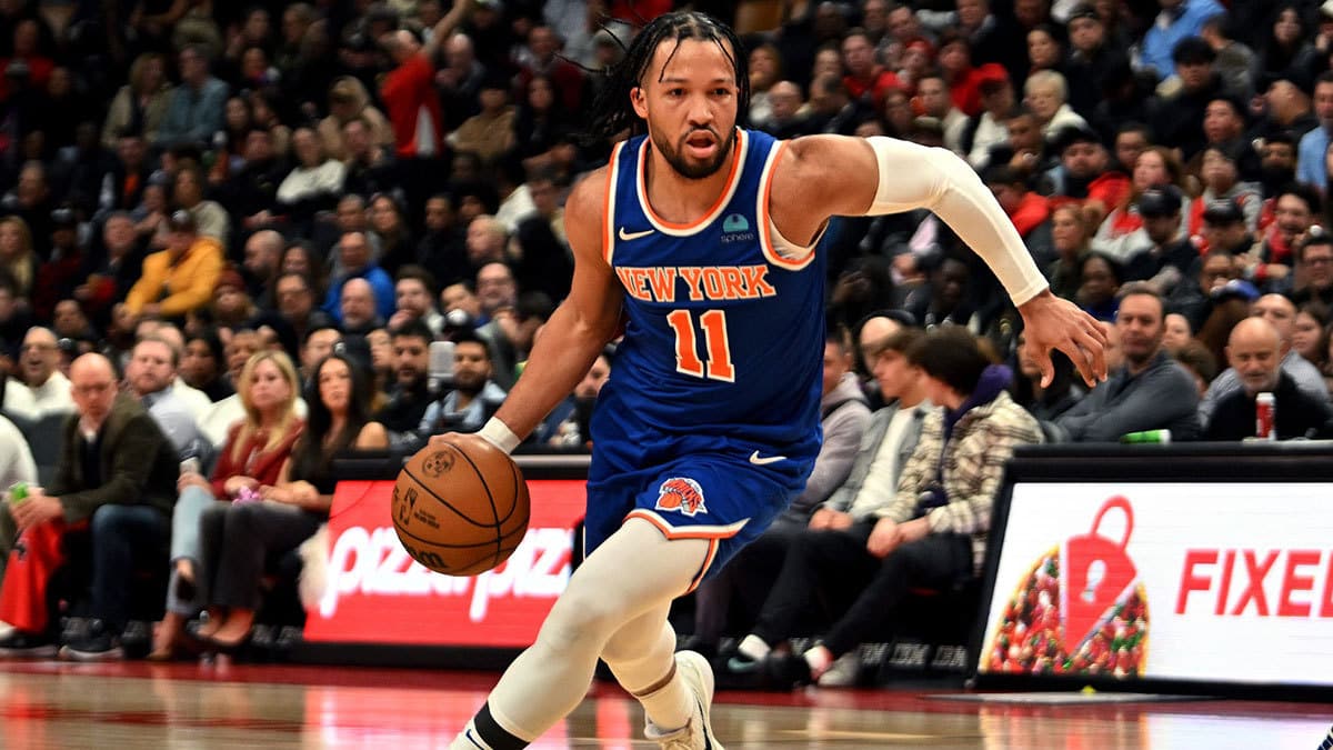New York Knicks guard Jalen Brunson (1) dribbles the ball against the Toronto Raptors in the first half at Scotiabank Arena.