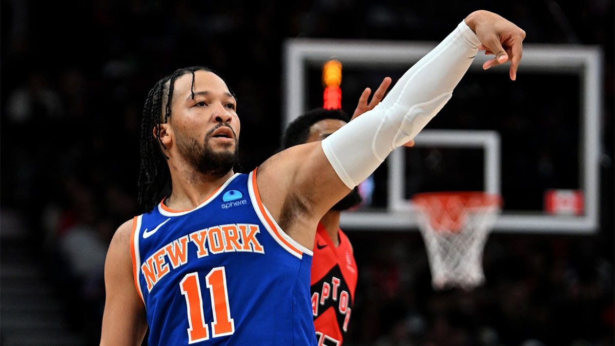 New York Knicks guard Jalen Brunson (11) follows through on a shot against the Toronto Raptors in the first half at Scotiabank Arena. 