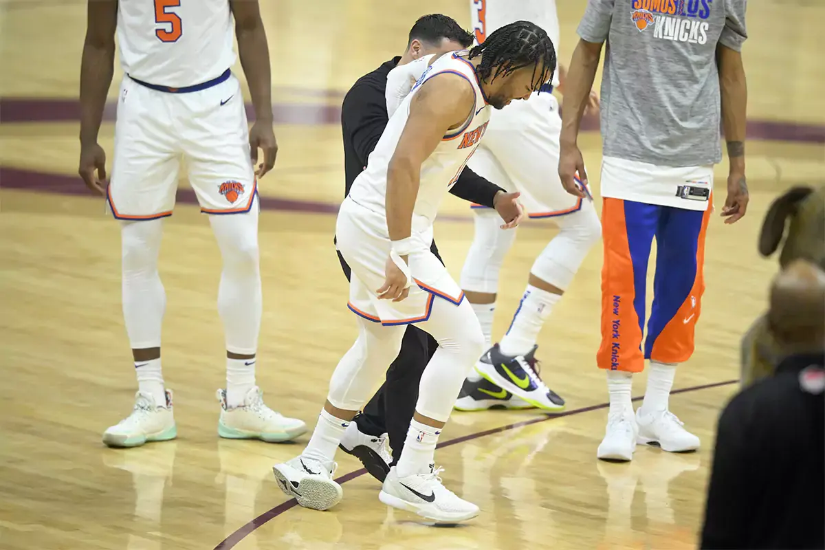 New York Knicks guard Jalen Brunson (11) limps off the court in the first quarter against the Cleveland Cavaliers at Rocket Mortgage FieldHouse.