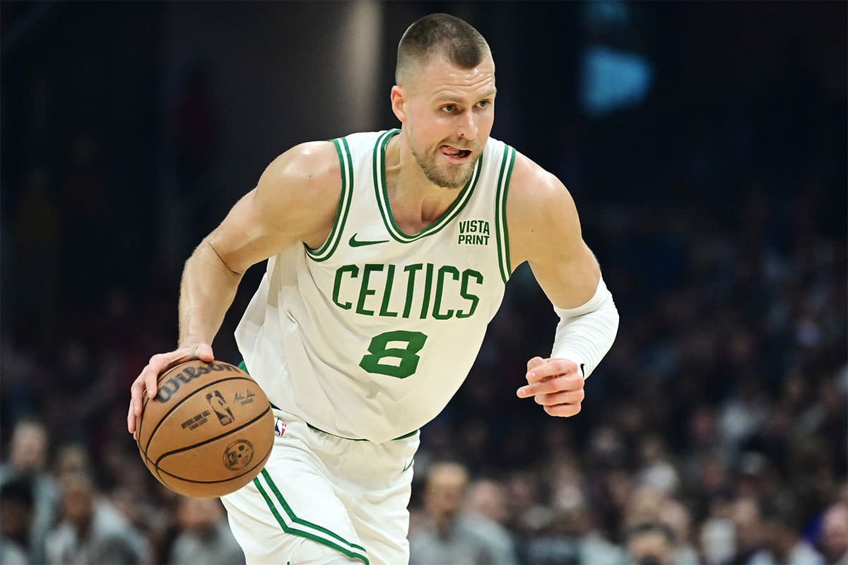 Boston Celtics center Kristaps Porzingis (8) brings the ball up court during the first half against the Cleveland Cavaliers at Rocket Mortgage FieldHouse.