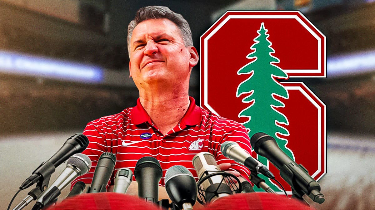 Stanford basketball coach Kyle Smith with microphones around him.