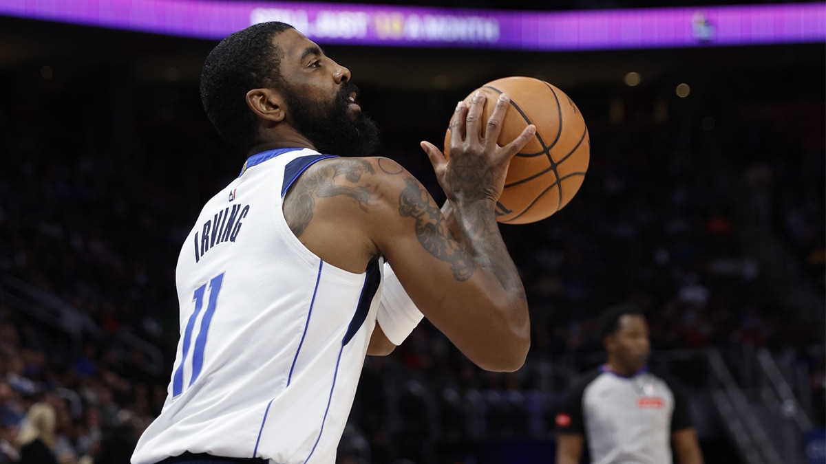 Dallas Mavericks guard Kyrie Irving (11) shoots in the first half against the Detroit Pistons at Little Caesars Arena