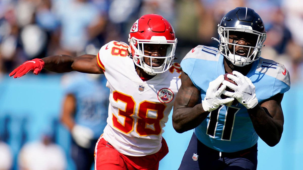 Tennessee Titans wide receiver A.J. Brown (11) pulls in a catch while pursued by Kansas City Chiefs cornerback L'Jarius Sneed (38) during the first quarter at Nissan Stadium Sunday, Oct. 24, 2021 in Nashville, Tenn.