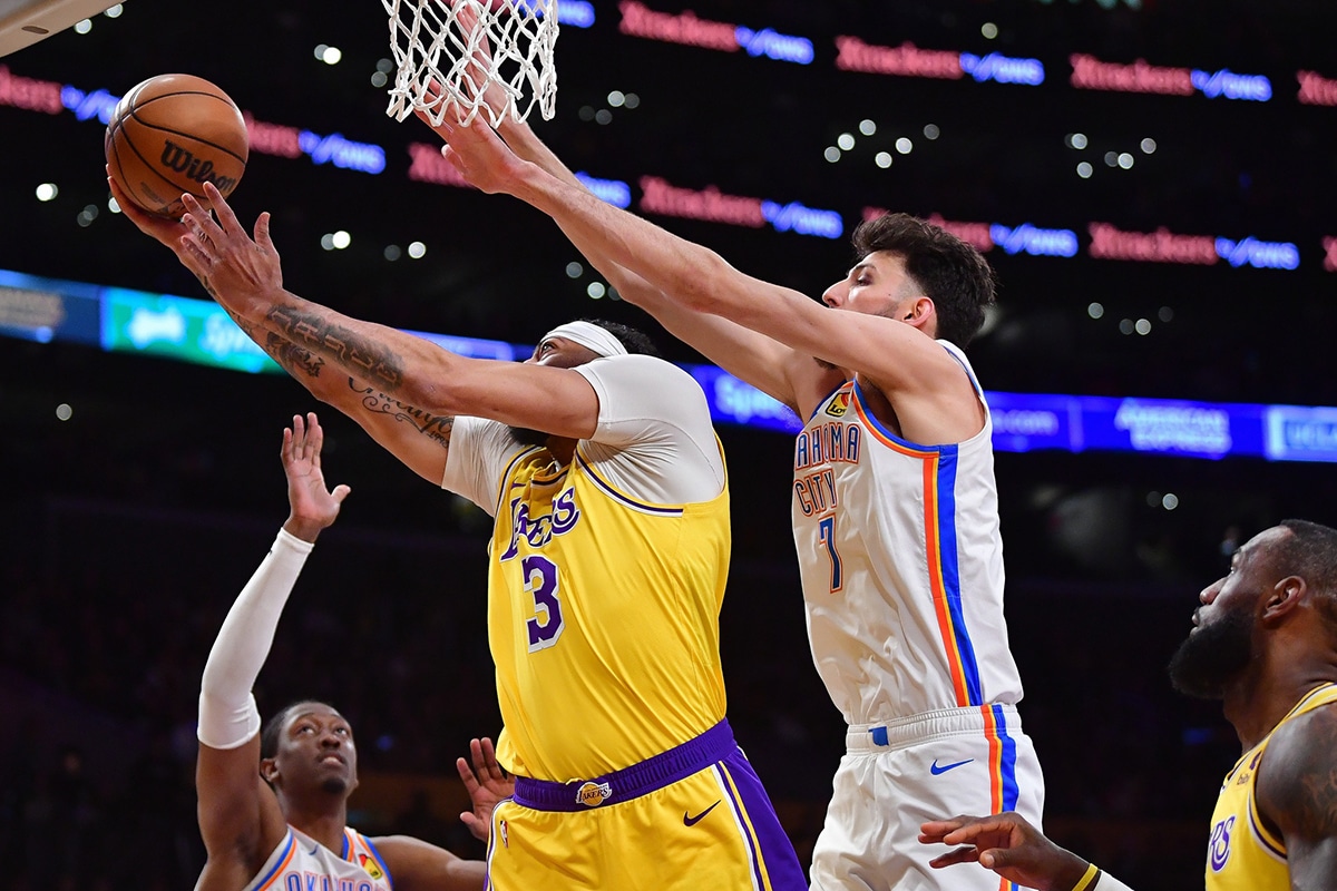 Los Angeles Lakers forward Anthony Davis (3) moves to the basket against Oklahoma City Thunder forward Chet Holmgren (7) during the first half at Crypto.com Arena
