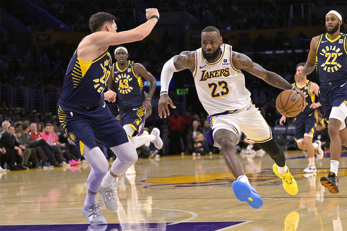 Los Angeles Lakers forward LeBron James (23) drives past Indiana Pacers forward Doug McDermott (20) in the second half at Crypto.com Arena.