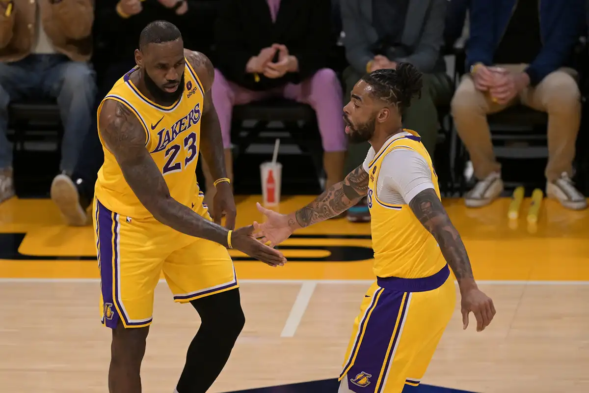 Los Angeles Lakers forward LeBron James (23) and guard D'Angelo Russell (1) slap hands after a basket in the first half against the Washington Wizards at Crypto.com Arena.