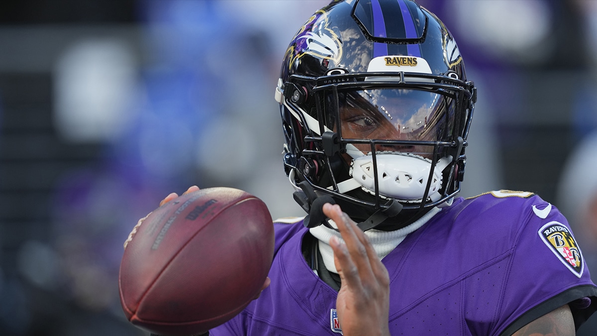 Baltimore Ravens quarterback Lamar Jackson (8) warms up before a 2024 AFC divisional round game against the Houston Texans at M&T Bank Stadium. 