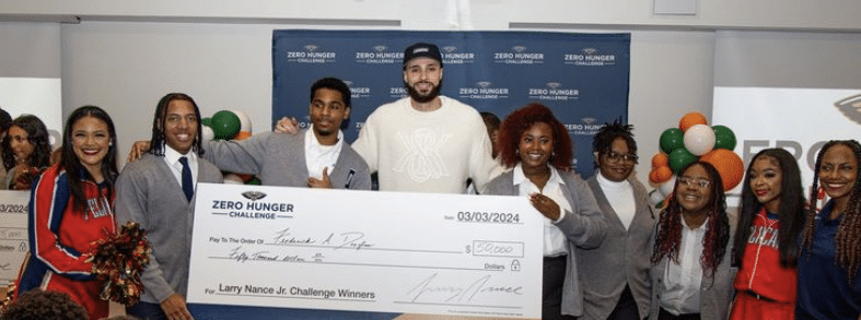 Larry Nance Jr. poses with Zero Hunger Challenge winners (credit Pelicans.com)
