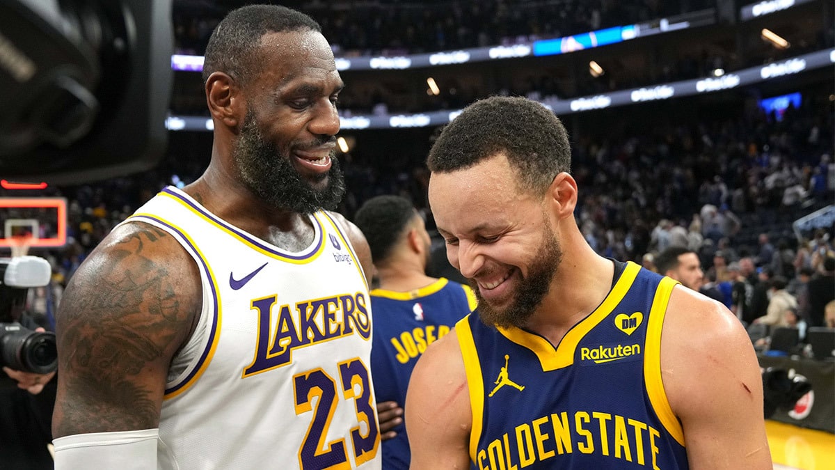 Los Angeles Lakers forward LeBron James (23) and Golden State Warriors guard Stephen Curry (right) talk after the game at Chase Center.