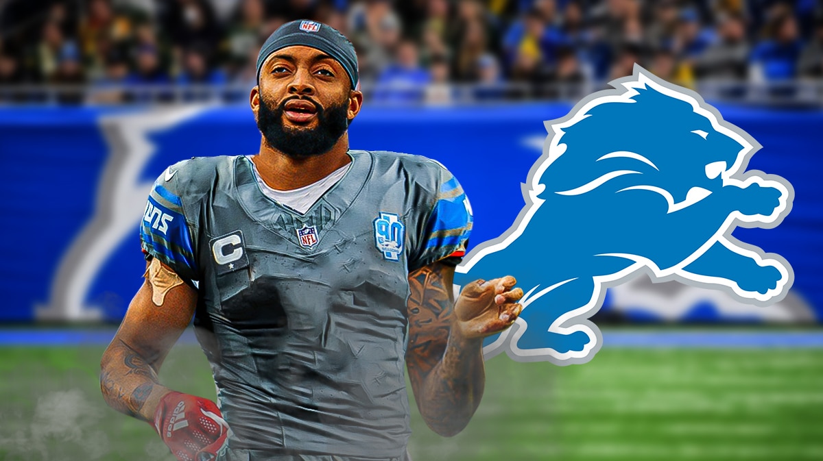 Carlton Davis wearing a Lions jersey next to a Lions logo at Ford Field