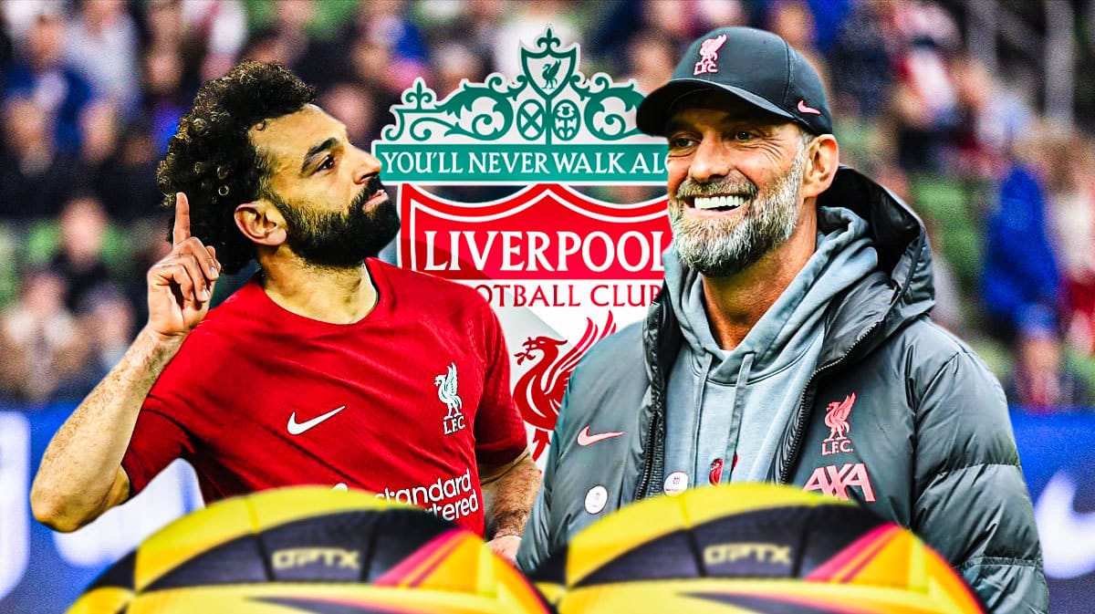 Mohamed Salah and Jurgen Klopp in front of the Liverpool logo