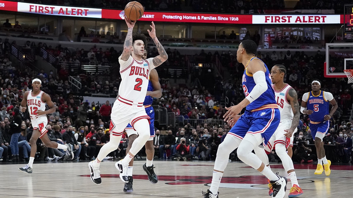 Chicago Bulls guard Lonzo Ball (2) looks to pass the ball against the Golden State Warriors during the first half at United Center