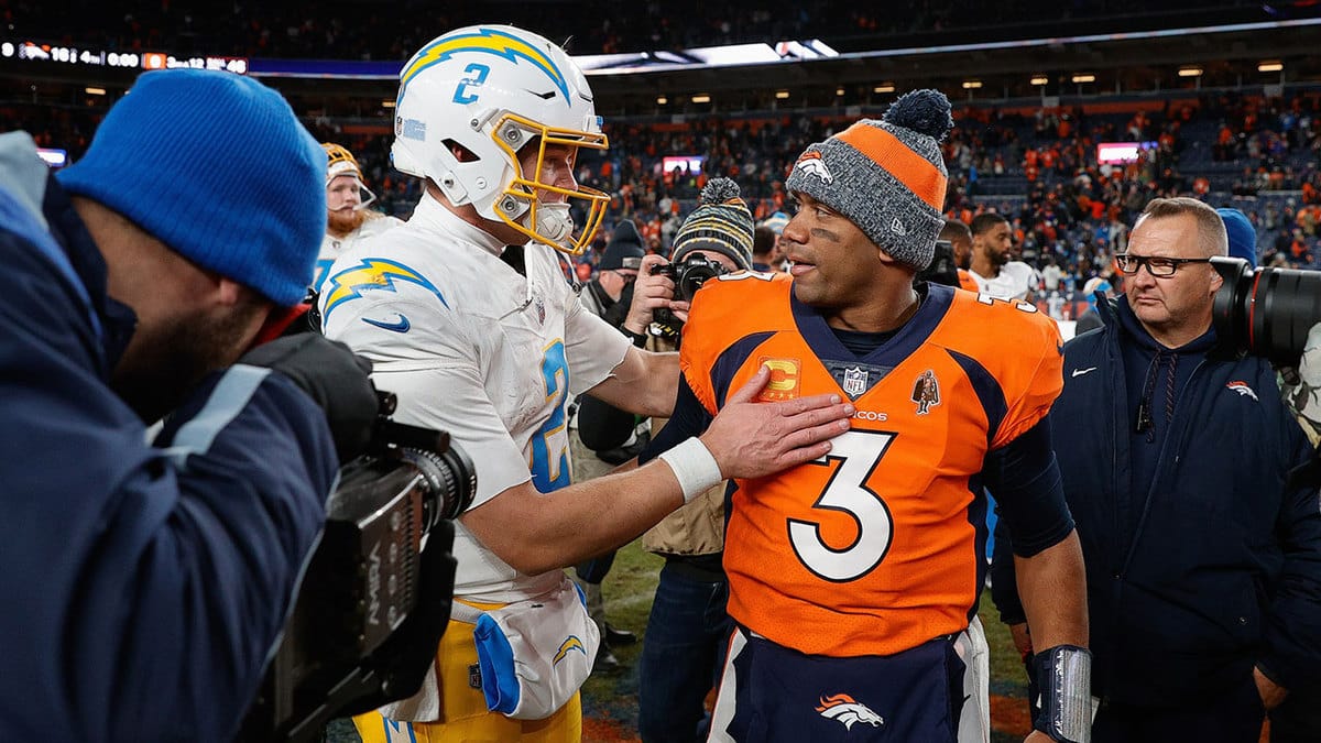  Los Angeles Chargers quarterback Easton Stick (2) and Denver Broncos quarterback Russell Wilson (3) after the game at Empower Field at Mile High