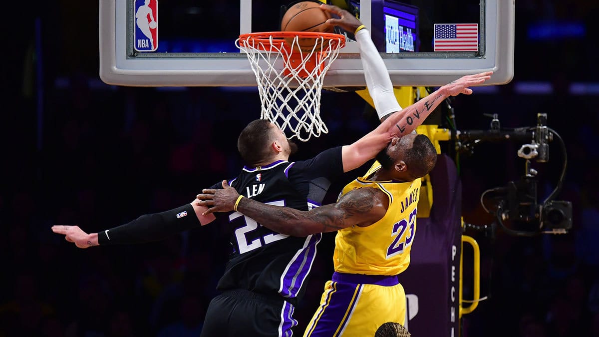 Los Angeles Lakers forward LeBron James (23) dunks for the basket against Sacramento Kings center Alex Len (25) during the first half at Crypto.com Arena