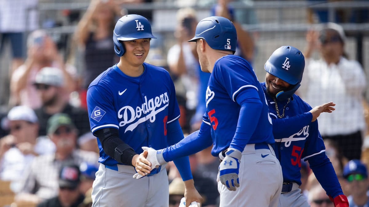  Los Angeles Dodgers designated hitter Shohei Ohtani (left) and Mookie Betts (right) celebrates with first baseman Freddie Freeman
