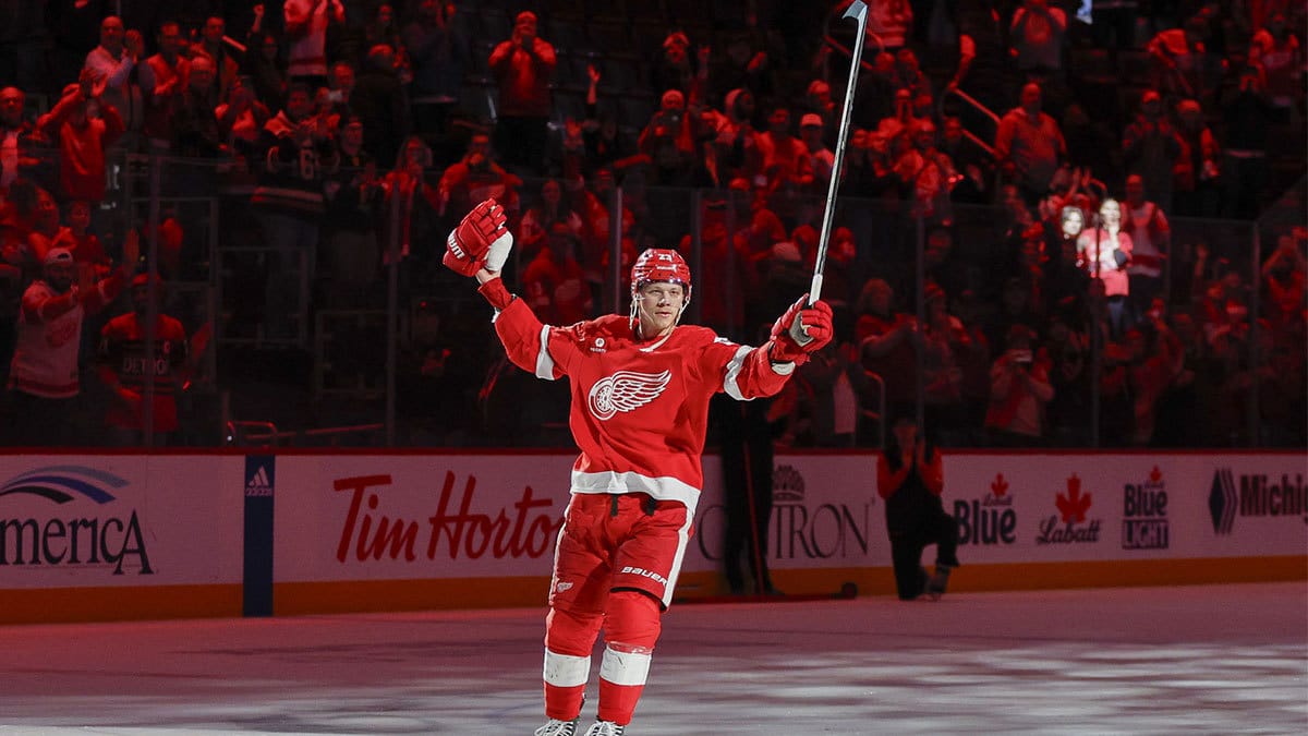 Lucas Raymond celebrates the Red Wings win over the Columbus Blue Jackets following the game at Little Caesars Arena.