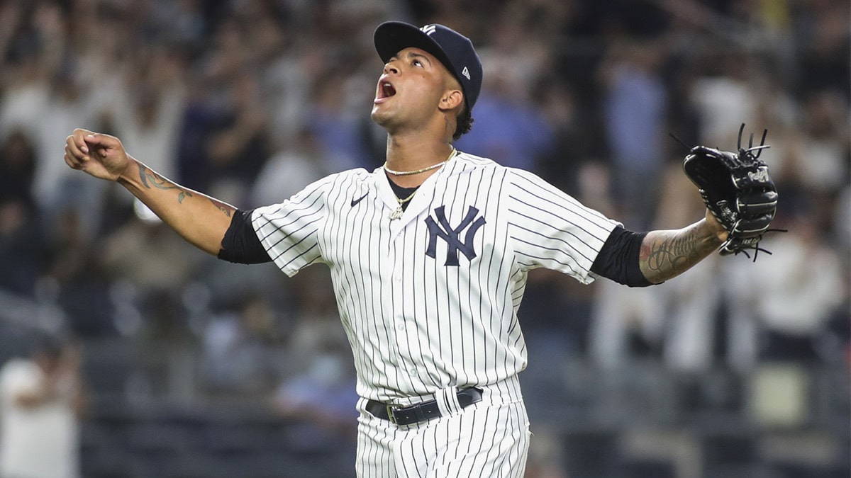 New York Yankees pitcher Luis Gil (81) reacts after a strike out to end the top of third inning with the bases loaded against the Toronto Blue Jays at Yankee Stadium