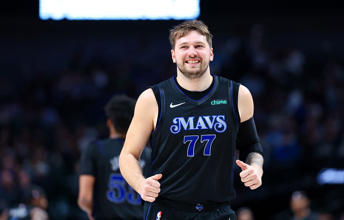 Dallas Mavericks guard Luka Doncic (77) laughs during the second half against the Utah Jazz at American Airlines Center.