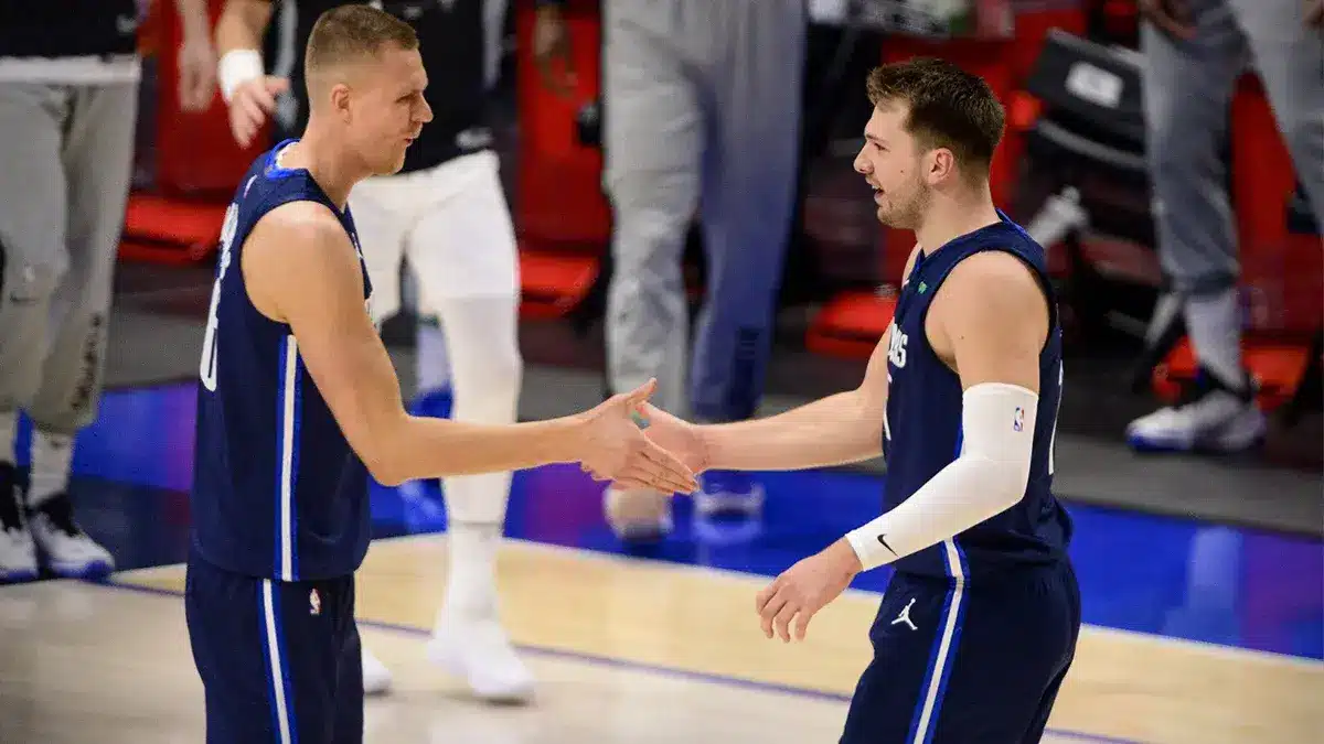 Dallas Mavericks center Kristaps Porzingis (6) and guard Luka Doncic (77) in action during game three between the Clippers and the Mavericks in the first round of the 2021 NBA Playoffs at American Airlines Center.