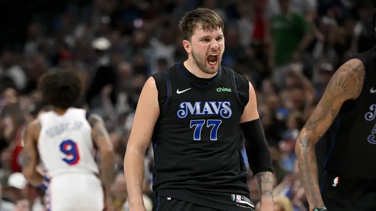 Dallas Mavericks guard Luka Doncic (77) celebrates after he makes a three point shot against the Philadelphia 76ers during the second half at the American Airlines Center.