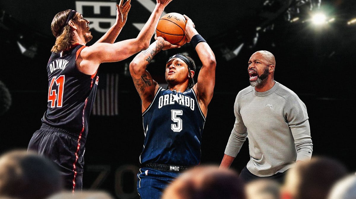 Magic F Paolo Banchero scoring on Raptors Kelly Olynyk with Jamahl Mosley seeming to be excited inside the KIA Center.