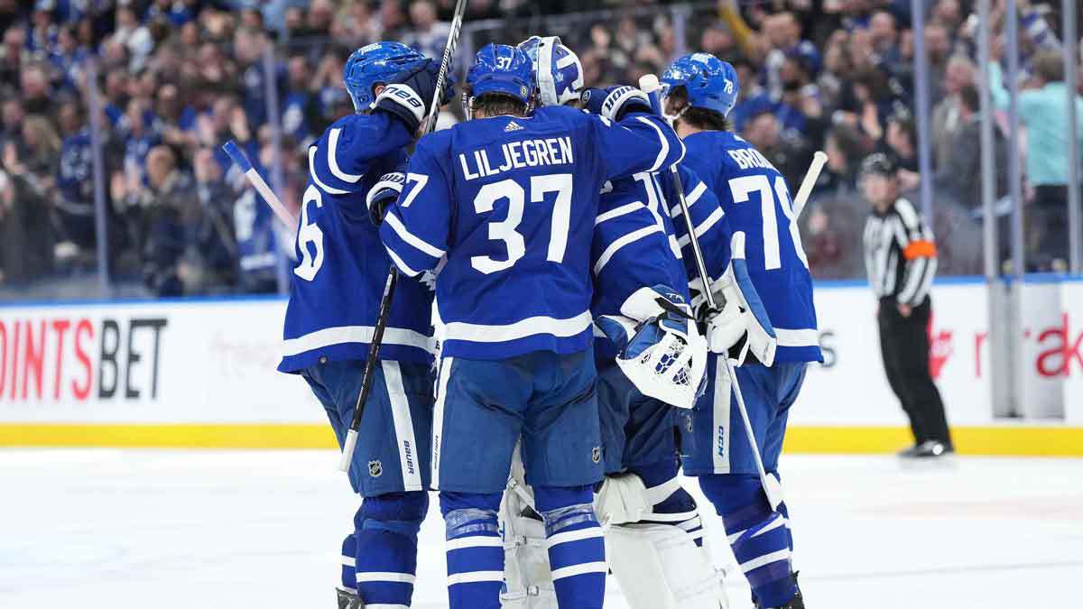 Toronto Maple Leafs defenseman Timothy Liljegren (37) celebrates the win with Toronto Maple Leafs goaltender Ilya Samsonov (35) against the Buffalo Sabres at the end of the overtime period at Scotiabank Arena.