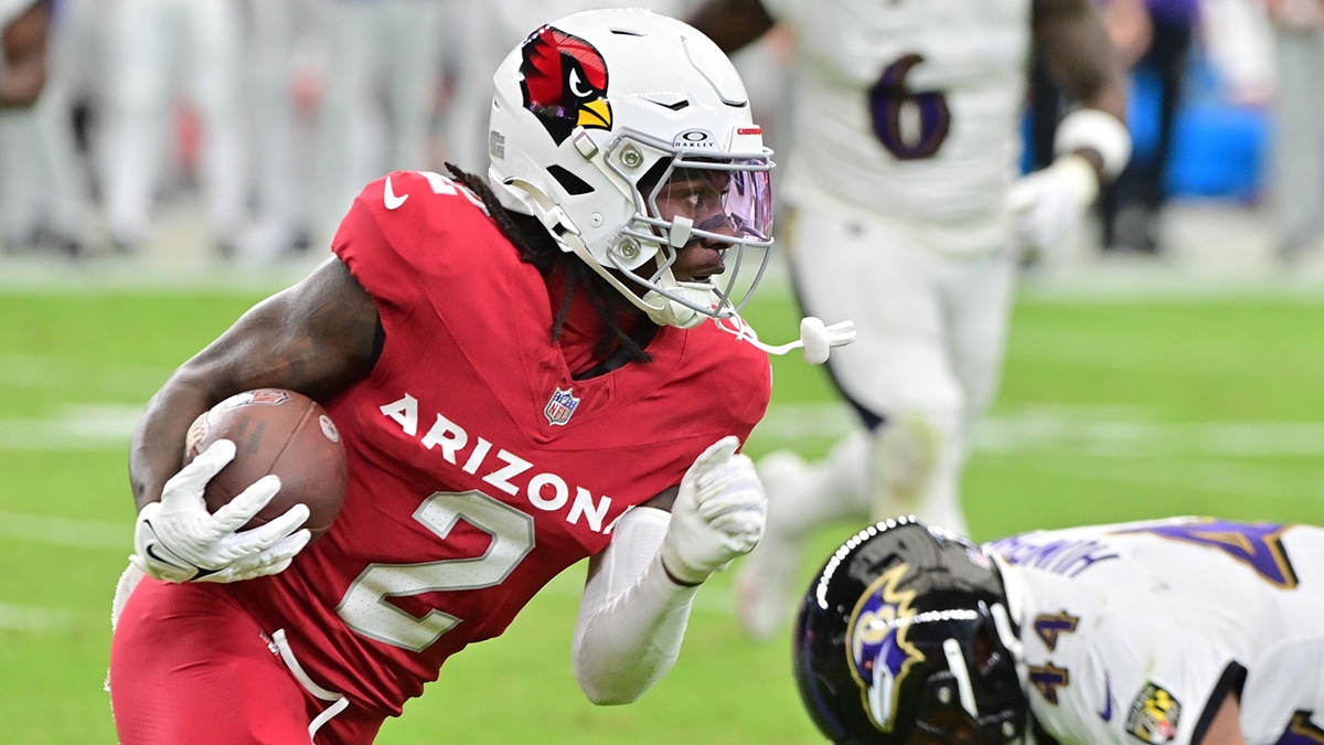 Arizona Cardinals wide receiver Marquise Brown (2) runs with the ball as Baltimore Ravens cornerback Marlon Humphrey (44) defends in the first half at State Farm Stadium.